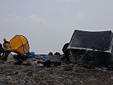 204 Camp Below Wind Swept Ridge Towards Dhampus Pass We camped just under the ridge to Hidden Valley in the wind-sheltered upper reaches of Yak Kharka at around 3800m. Snow was falling as Pemba Rinji and Mingma put my tent.